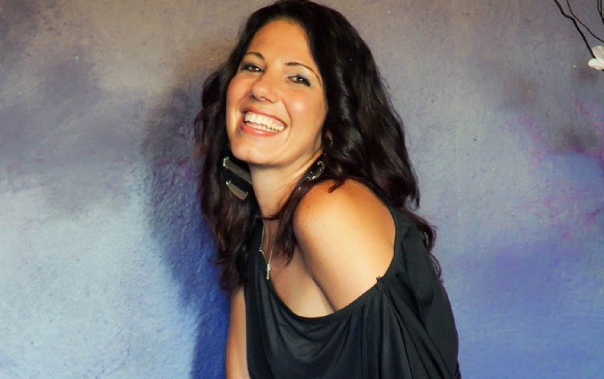 female Musician smiling warmly at camera