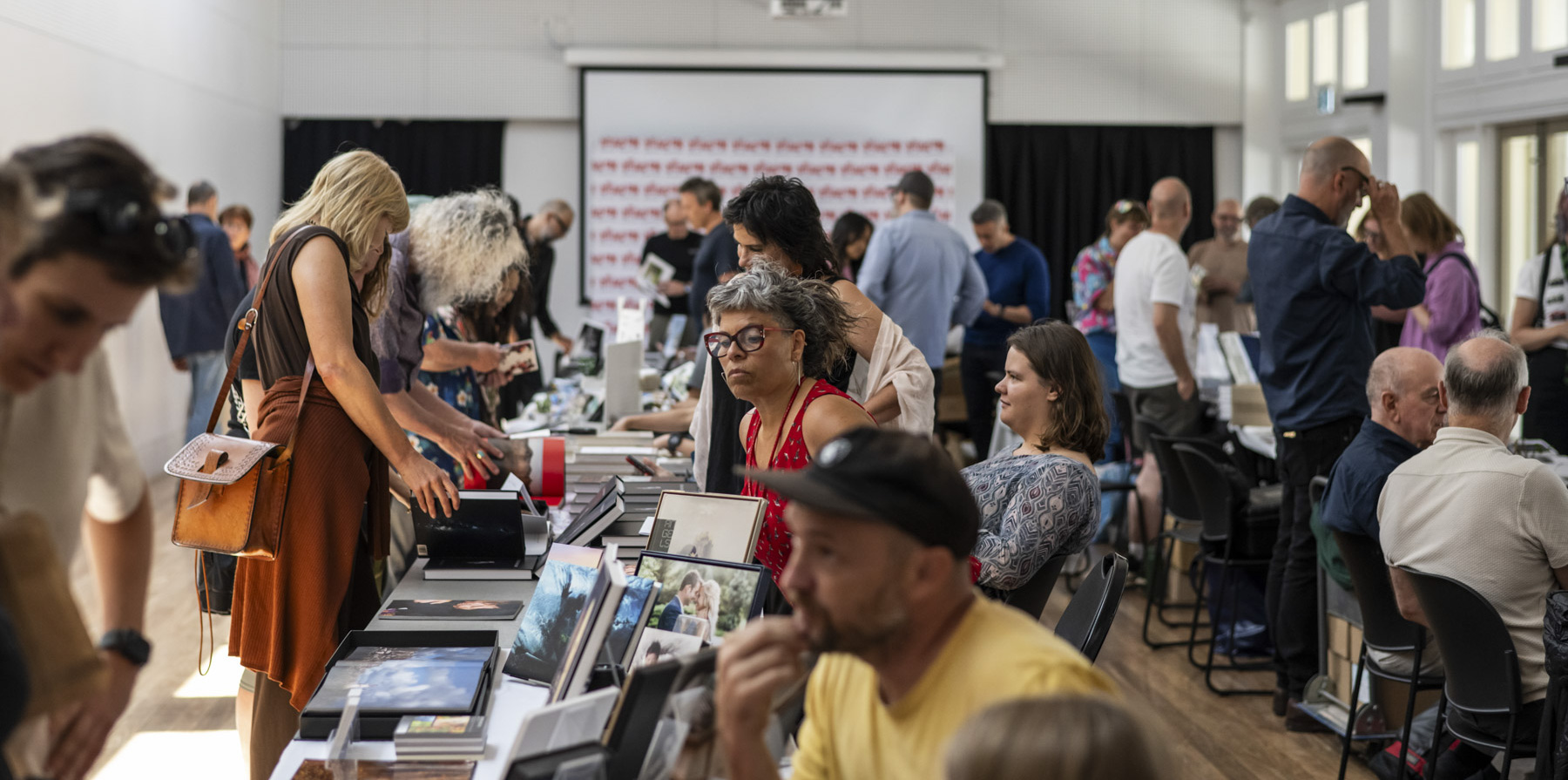A photo book market where artists and photographers display their work, giving visitors the chance to browse, experience and buy books directly from the artists.