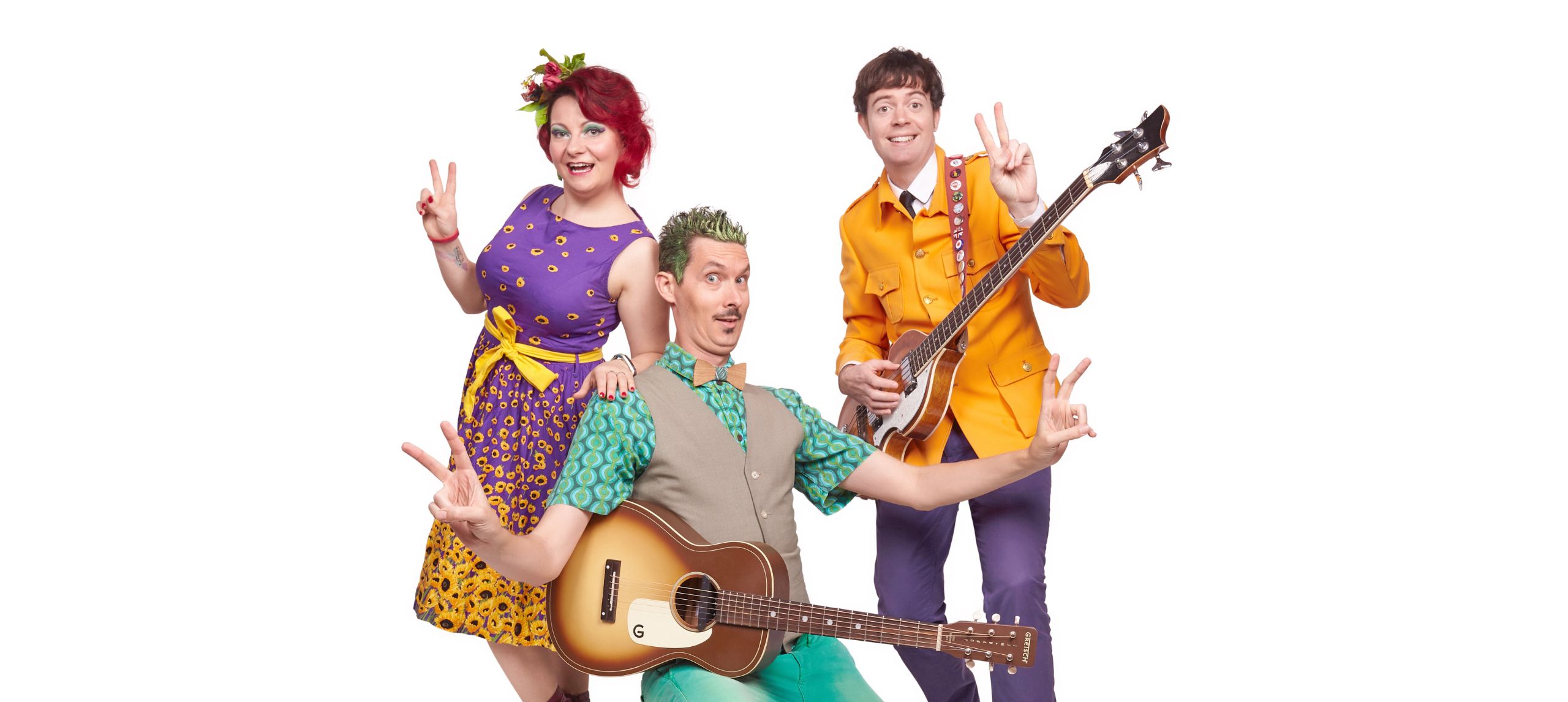 Two people with guitars and another person smiling at the camera.  All performers are doing the peace sign