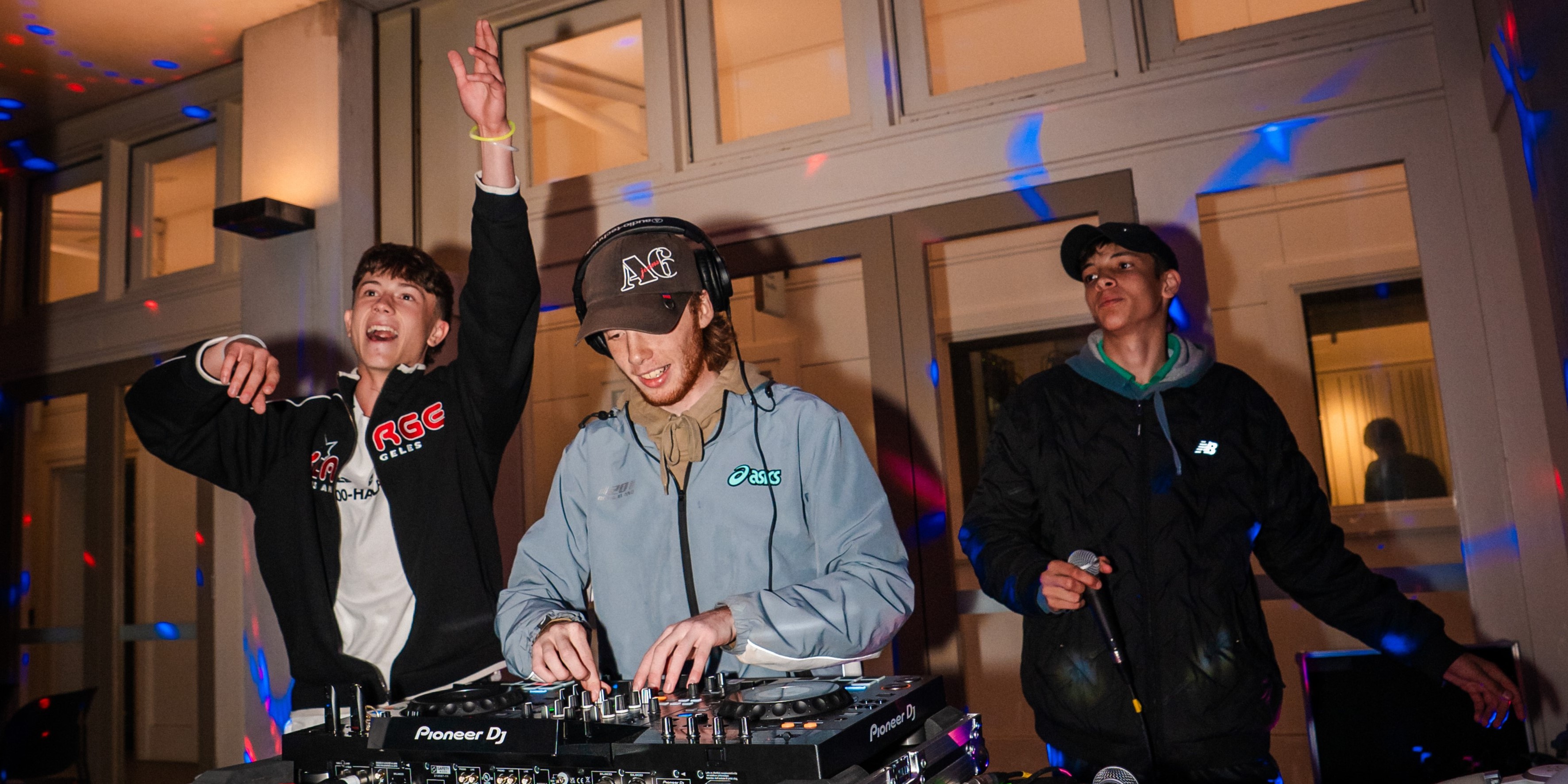 Three young DJs performing at Beach Bash 
