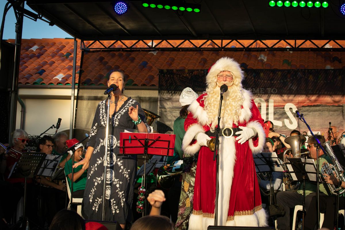 Santa, female singer and Brass band on stage