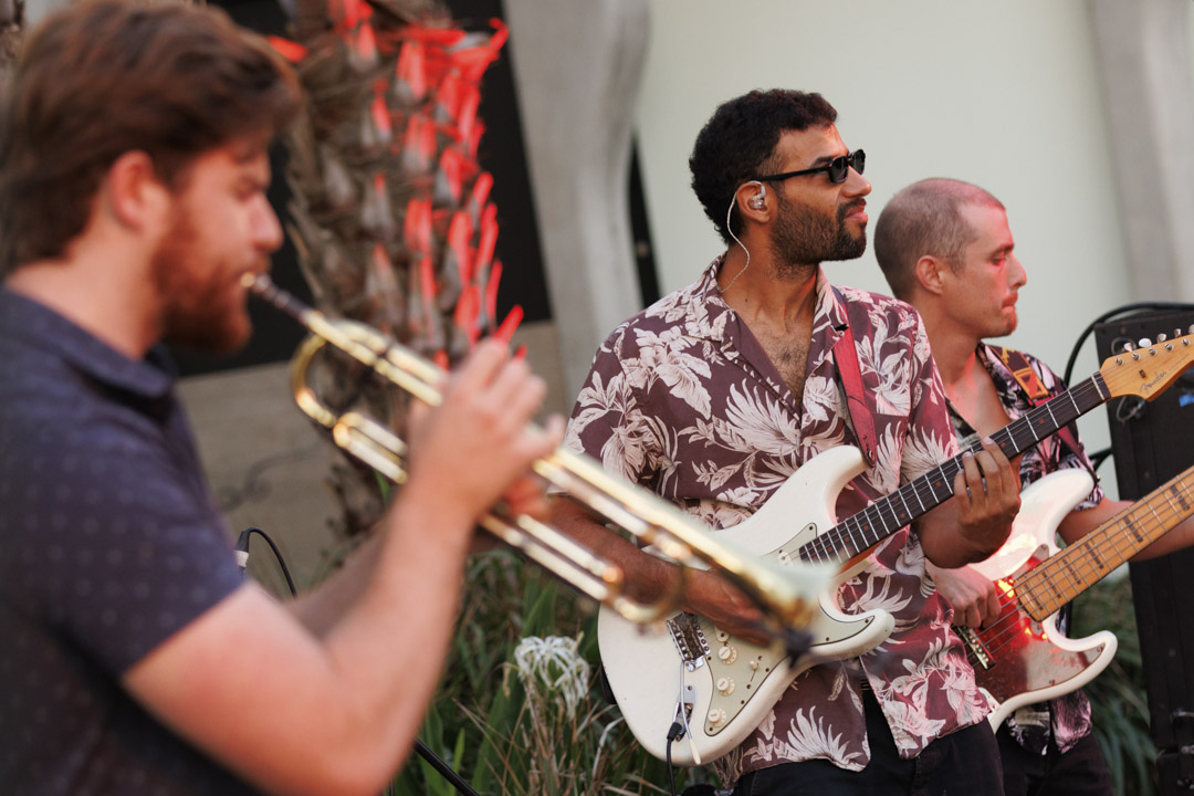 Musician playing instruments such as guitar on the evening of the Head On Photo Festival launch.