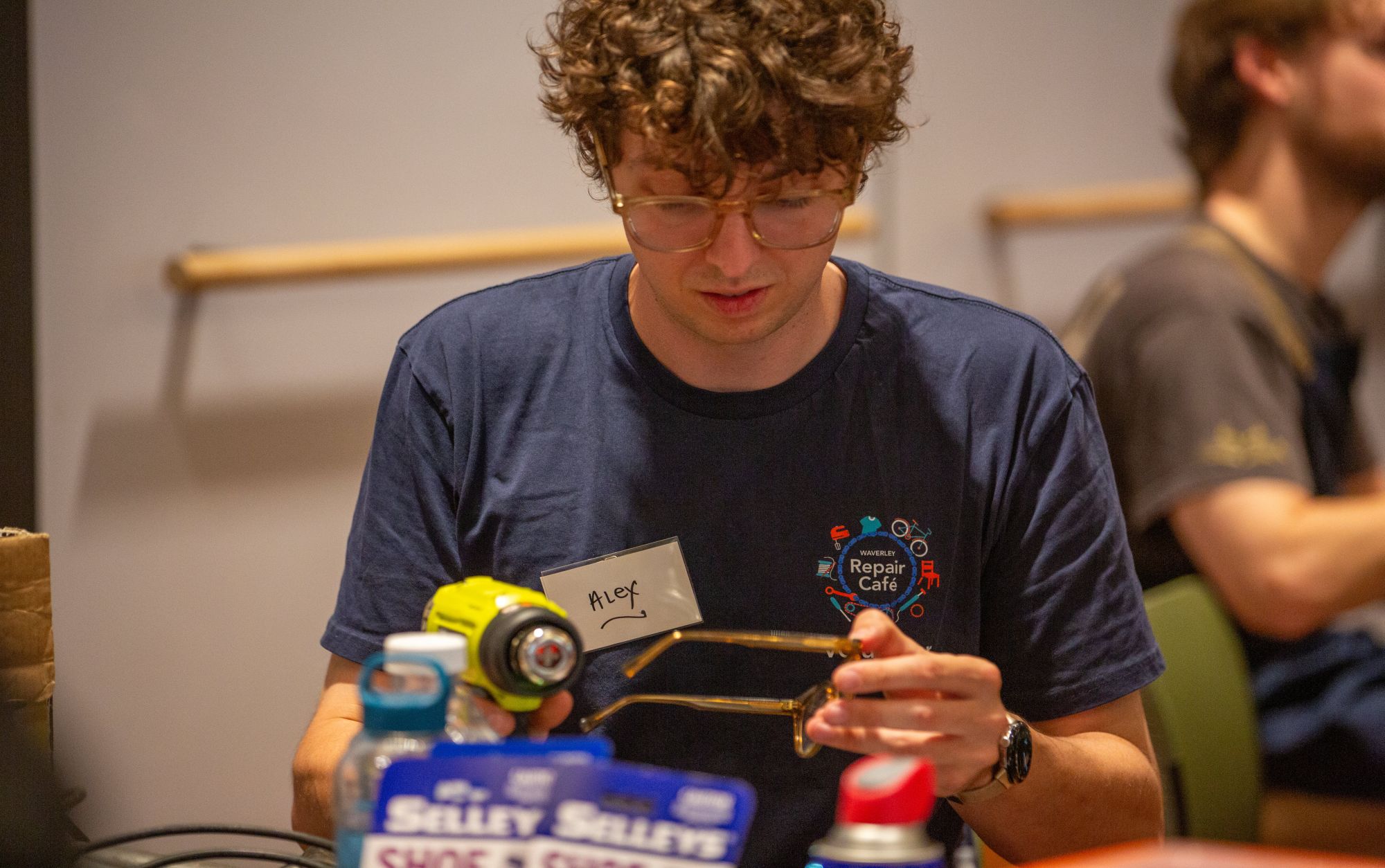 Man repairing glasses