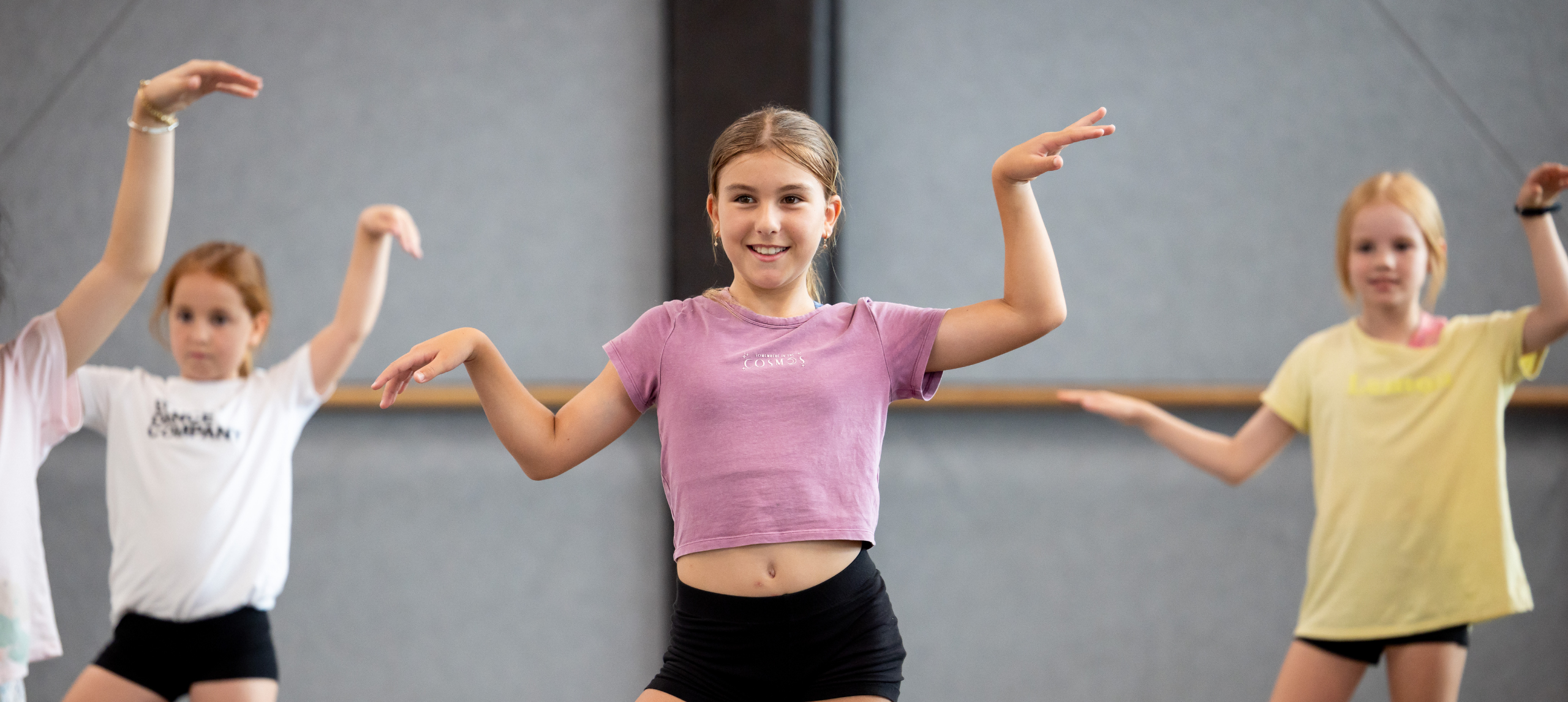 3 young girls dancing in a studio