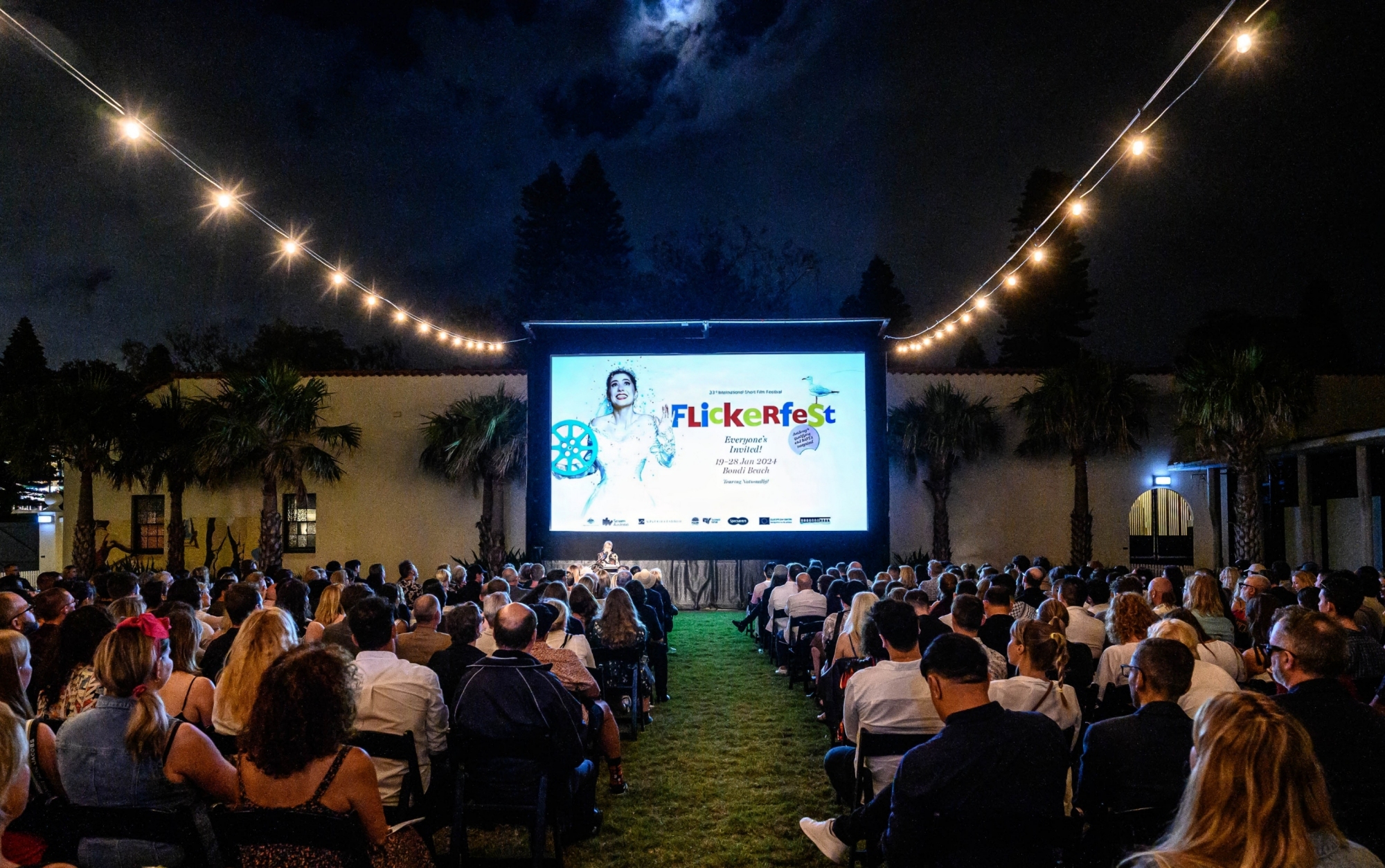 Flickerfest outdoor cinema audience enjoying the best of short films from around the world, in the Bondi Pavilion Garu Courtyard 