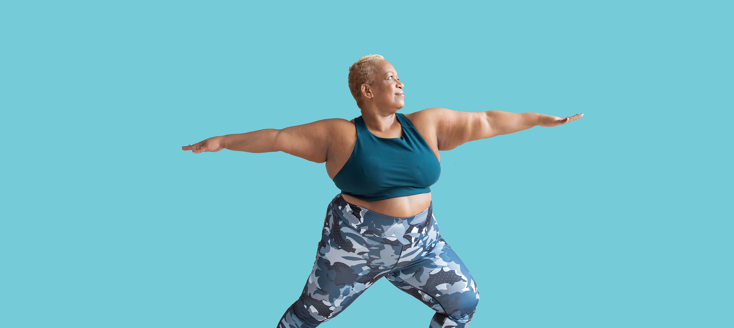 Lady doing warrior yoga pose