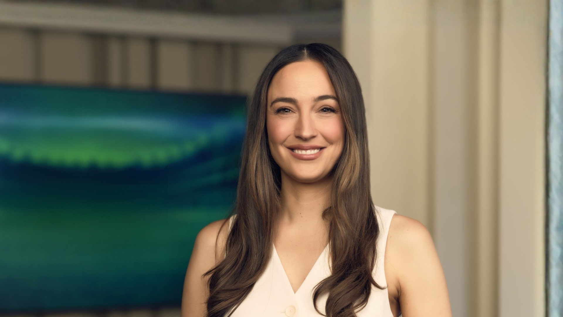 Abbey Gelmi smiles into the camera from the set of Offsiders