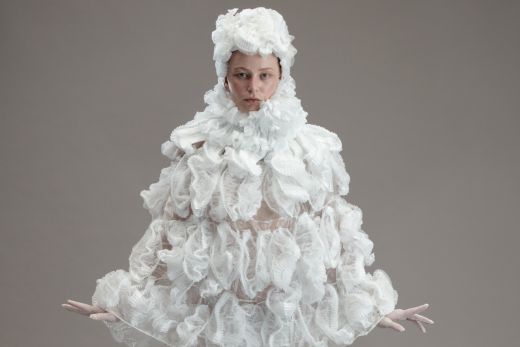 Woman in white costume. Image by Sue Stafford.
