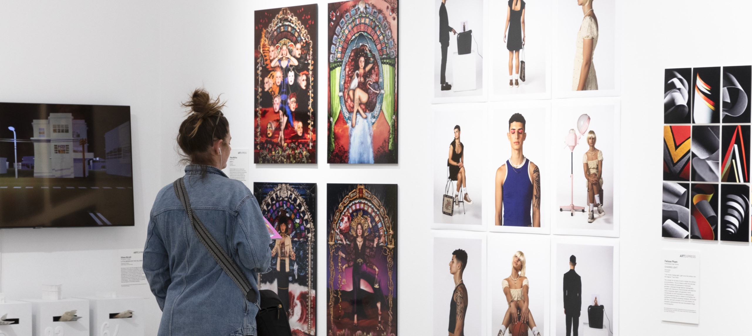 Woman looking at HSC students' artworks at Bondi Pavilion Art Gallery, image by Silversalt Photography.