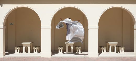 Woman performing with silver textile at Bondi Pavilion; Photo by Zan Wimberley