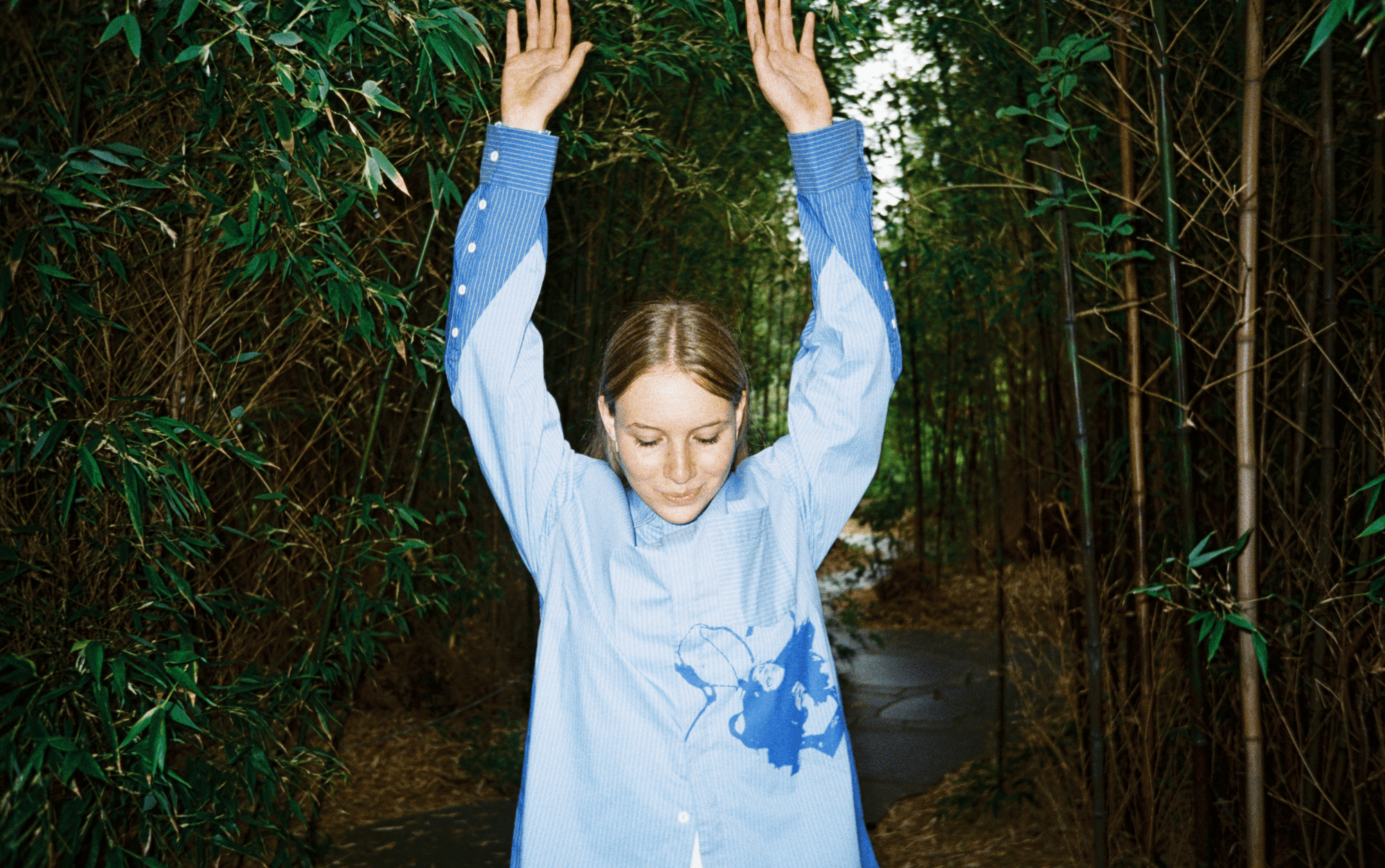 A woman musician with hands in the air