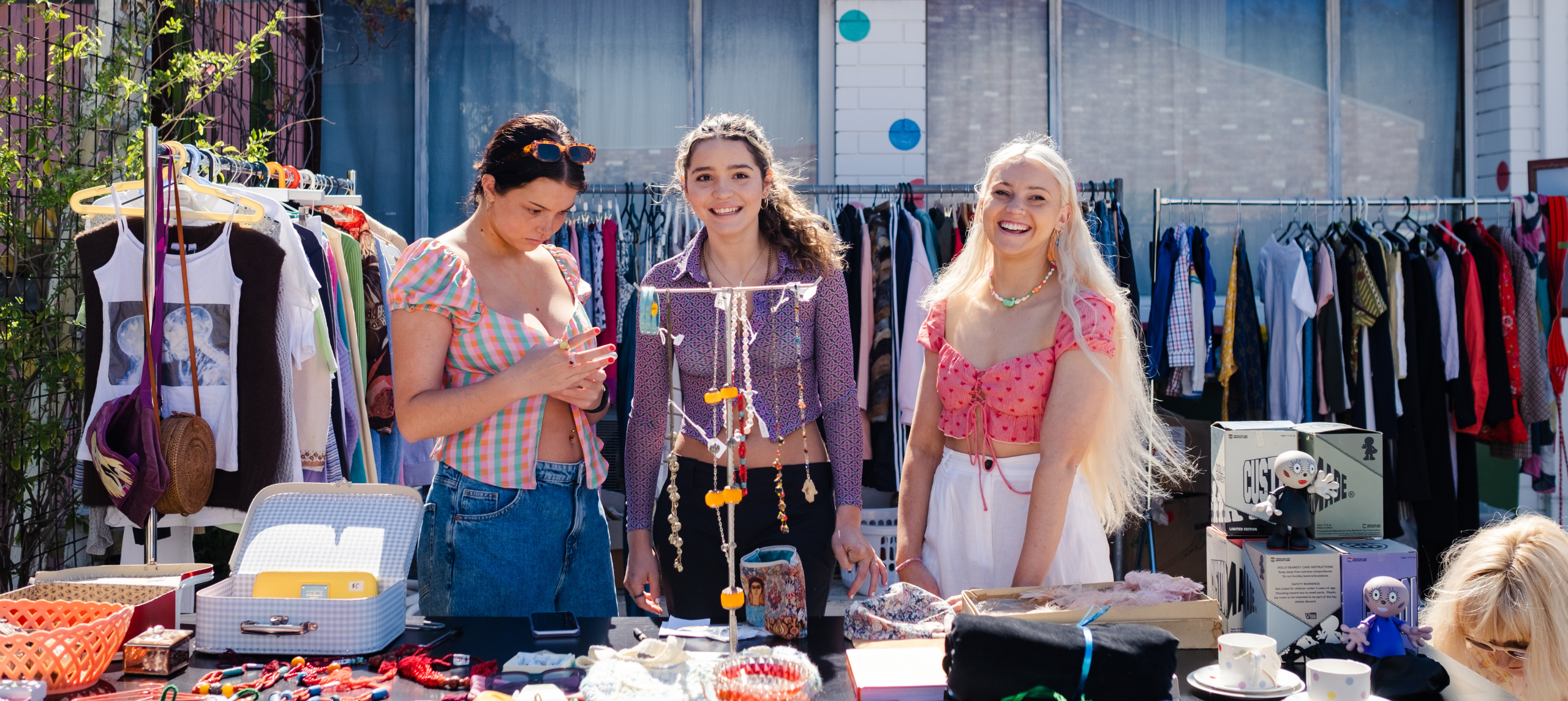 Youth selling items at a flea market 